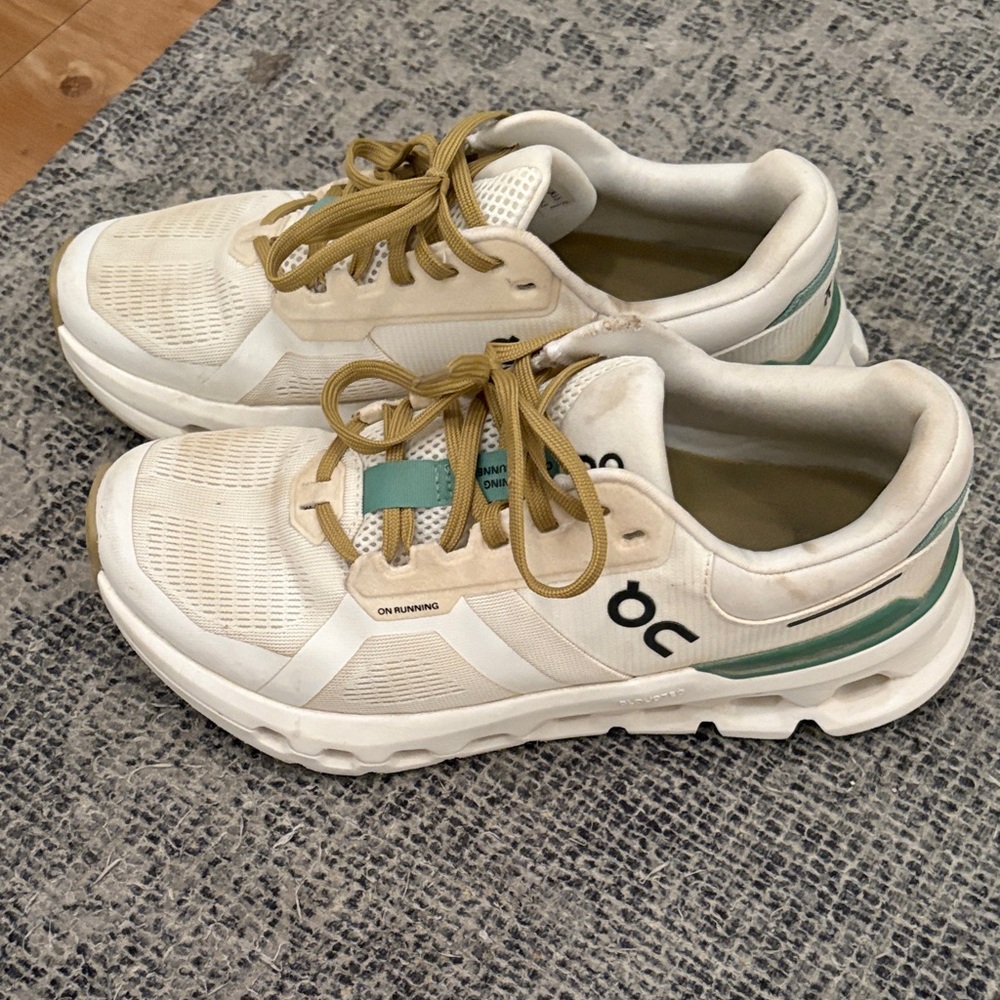 On Running Cream and Green Athletic Shoes